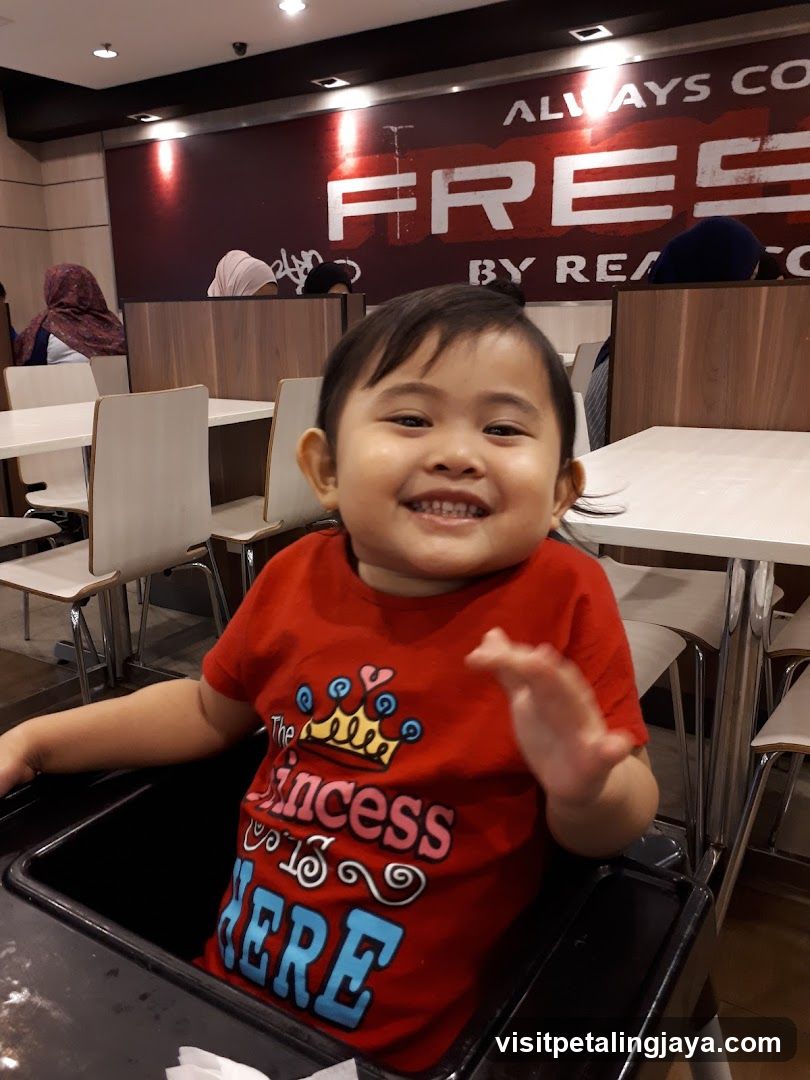 Child in restaurant interior
