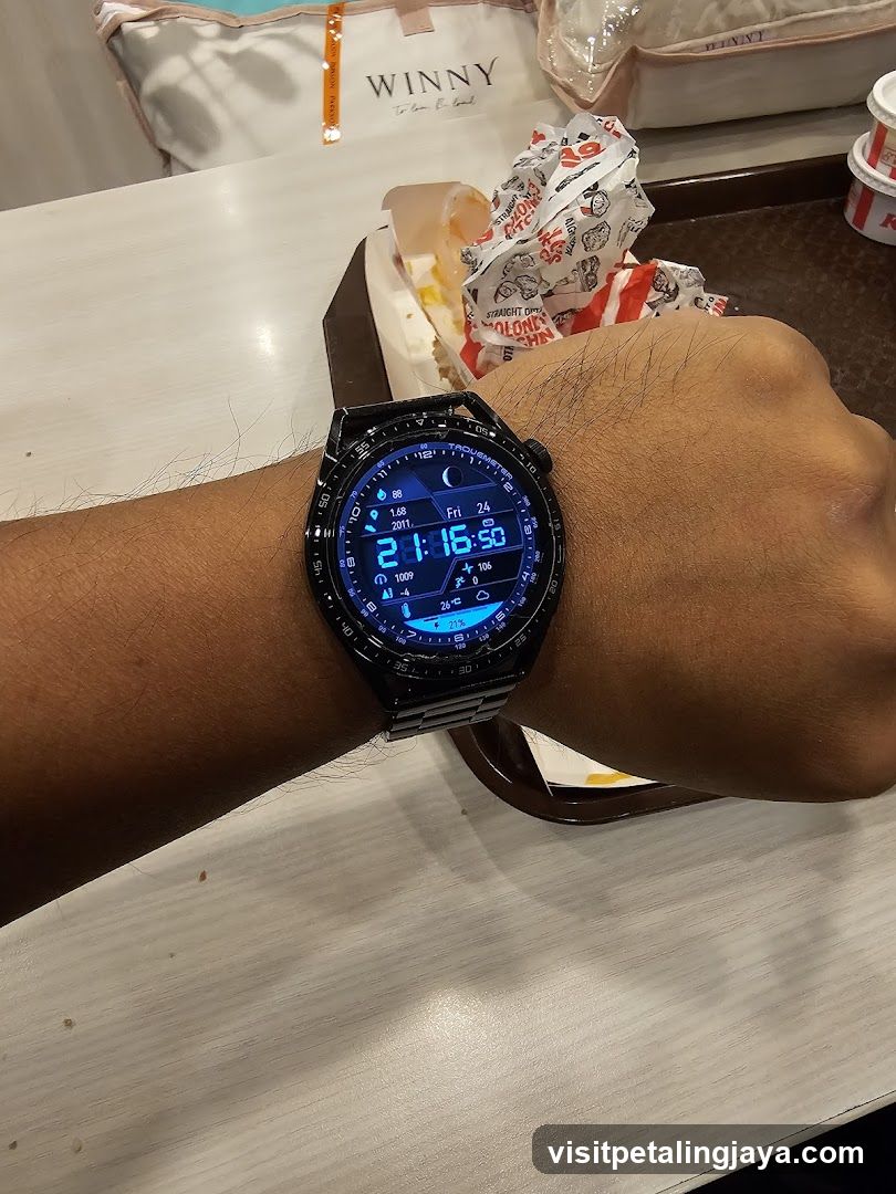 Hand wearing smartwatch at dining table