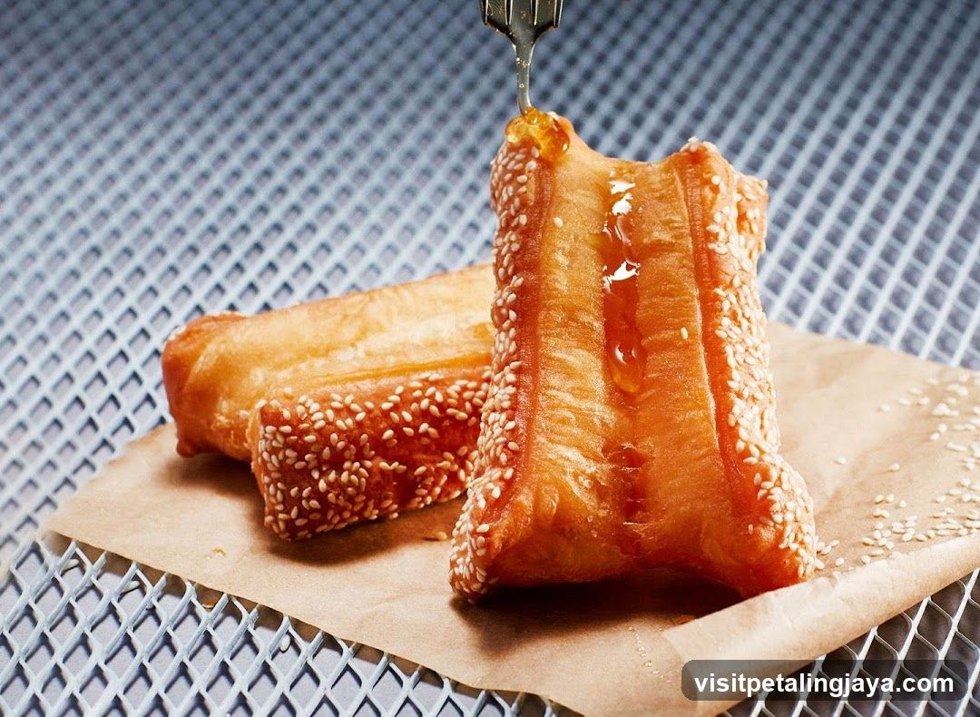 Fried Dough Sticks with Sesame Seeds and Honey