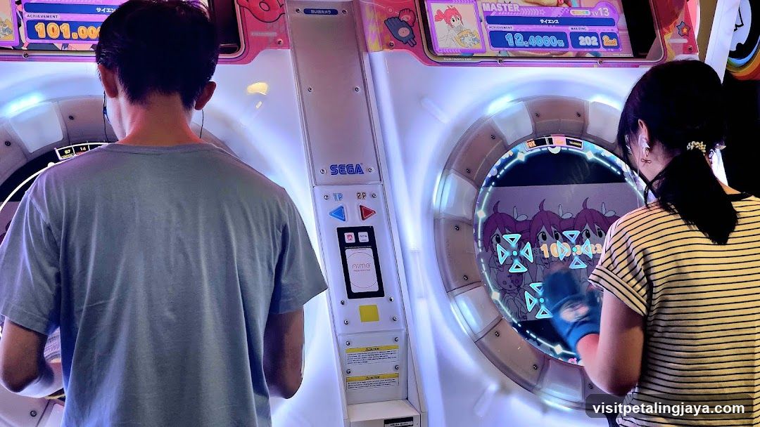 People Playing Arcade Game