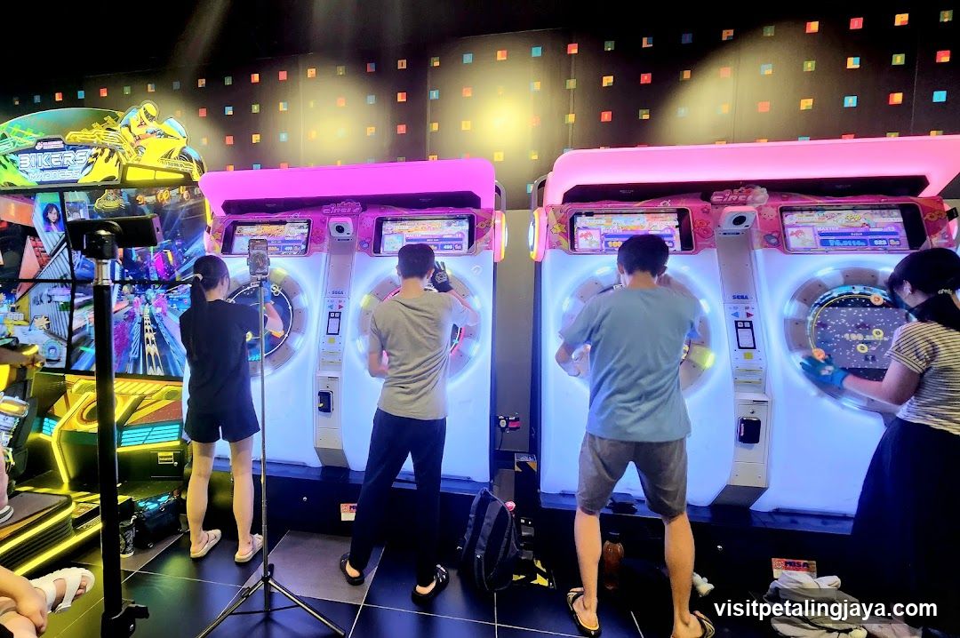 People playing arcade games