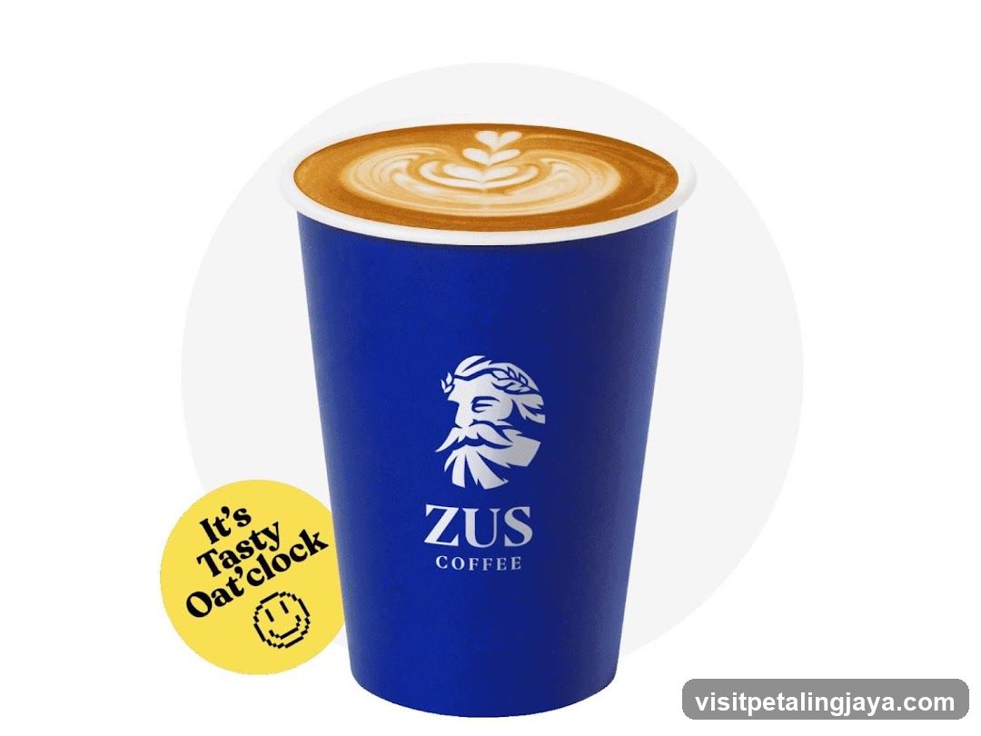 Latte with ZUS Coffee logo