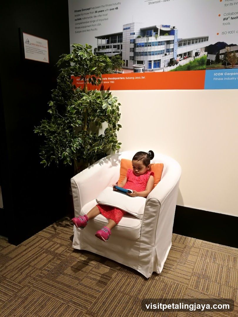 Child using a tablet in a waiting area