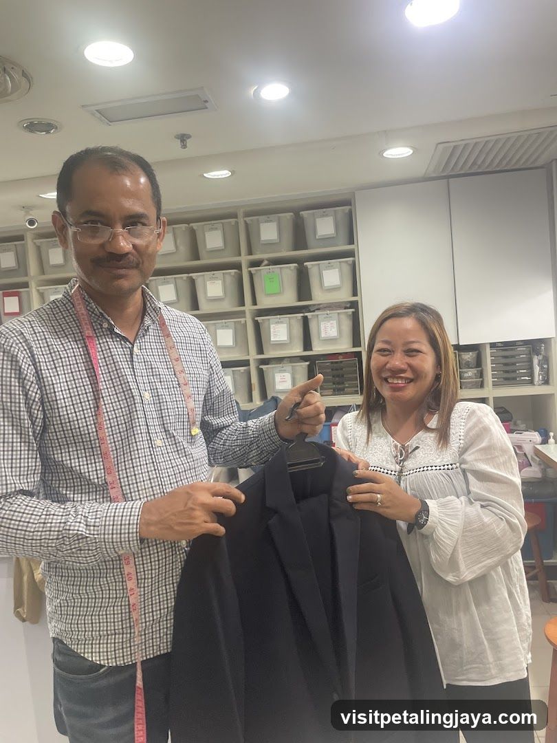 Tailor showing a suit
