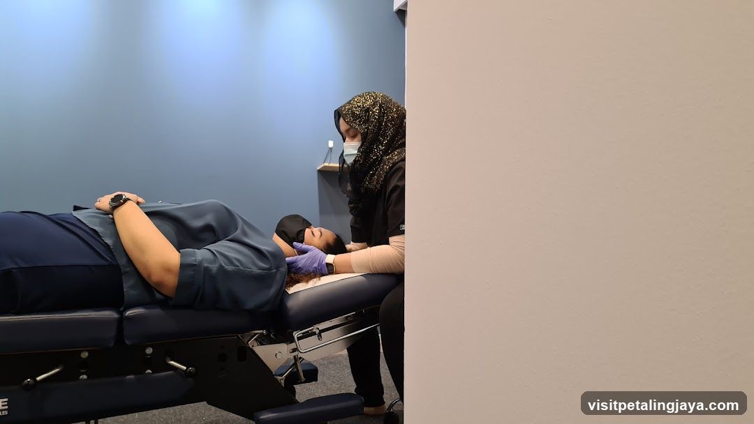 Chiropractor Adjusting Patient