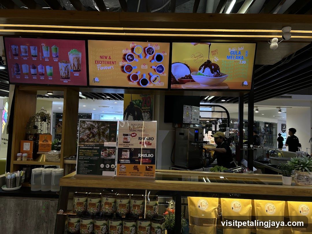 Dessert shop counter with digital menus and products
