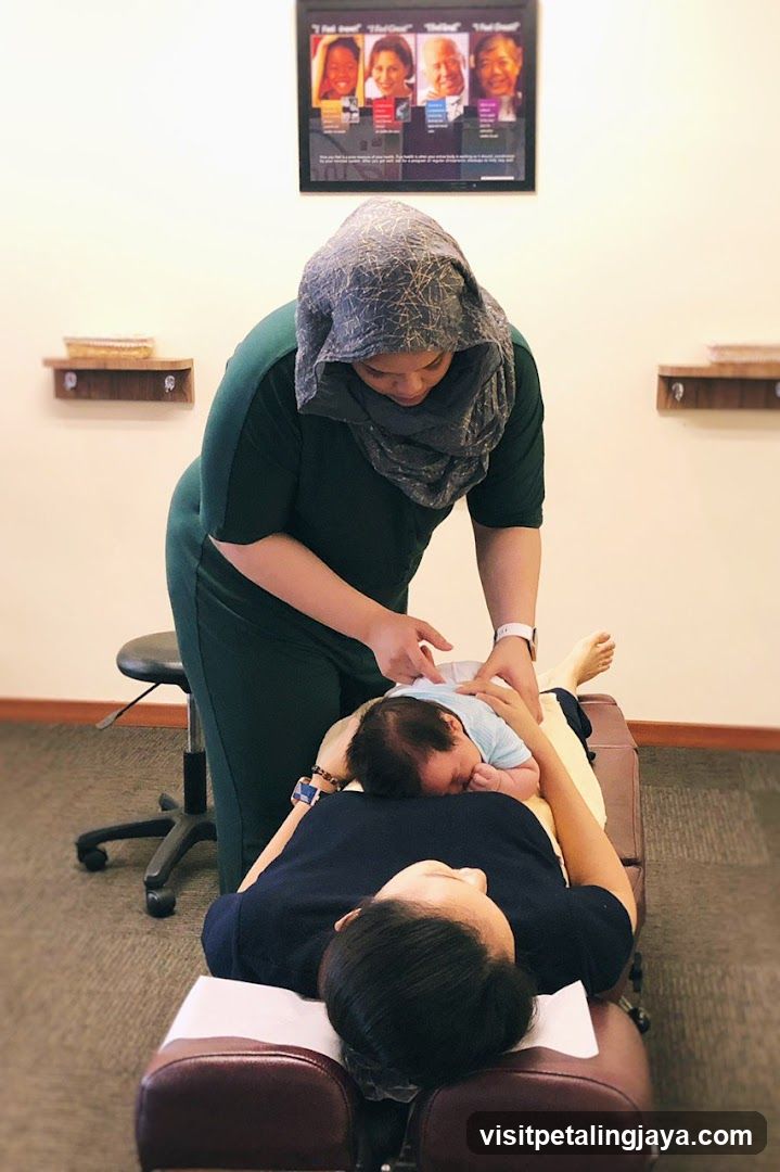 Chiropractor adjusting a baby