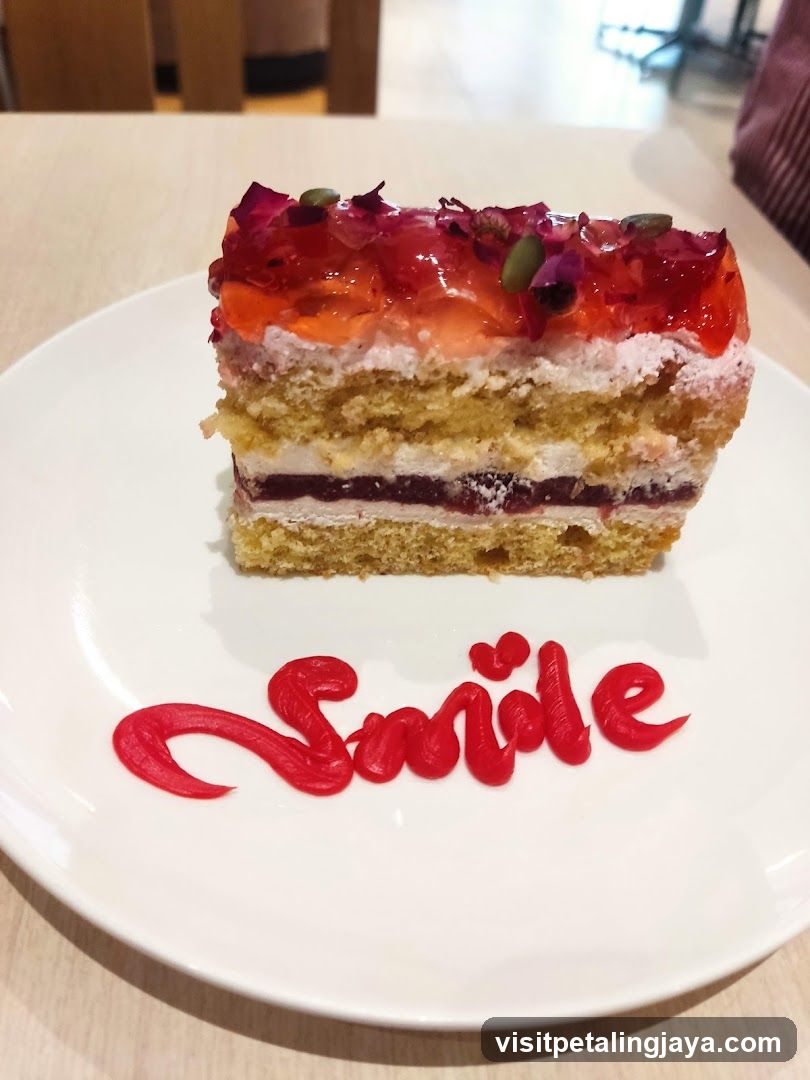 Slice of cake with "Smile" written in icing