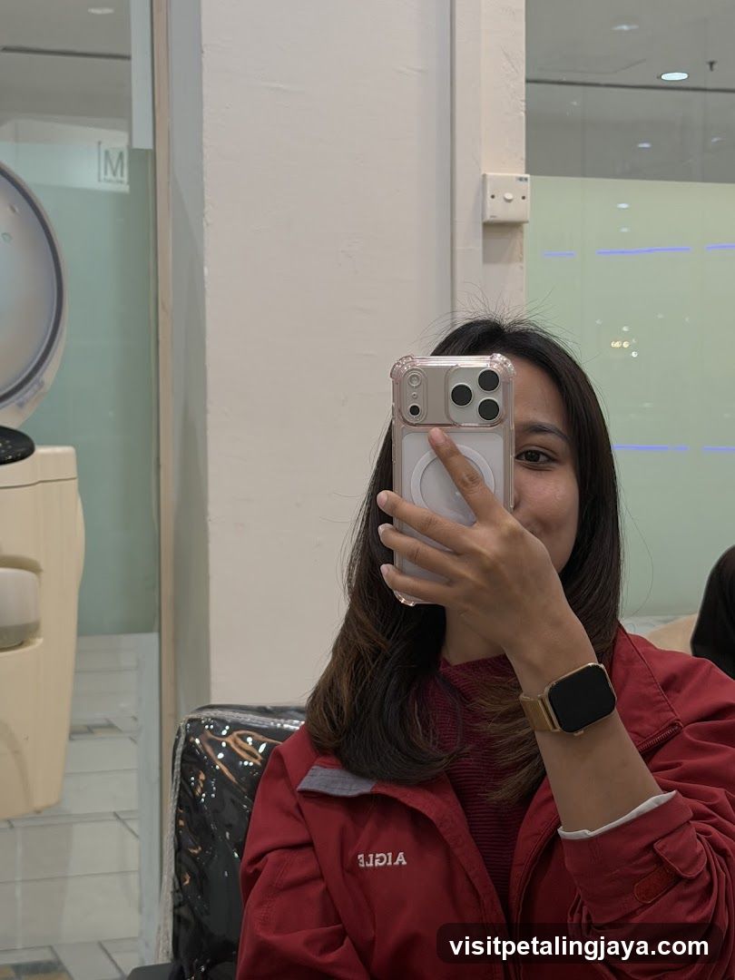 Woman taking a mirror selfie in a salon