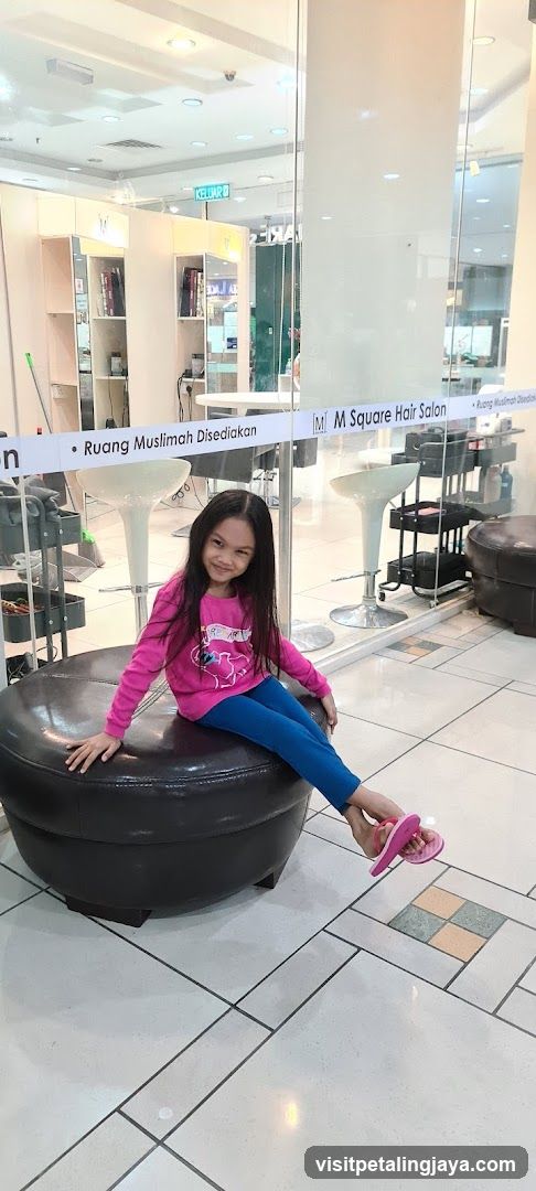 Young girl sitting in a salon