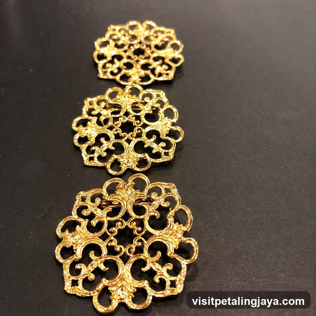 Three gold brooches