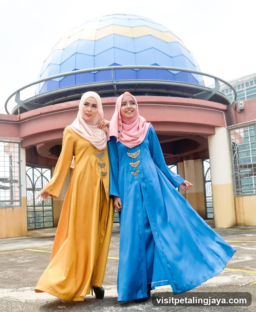 Two Women Posing in Traditional Attire