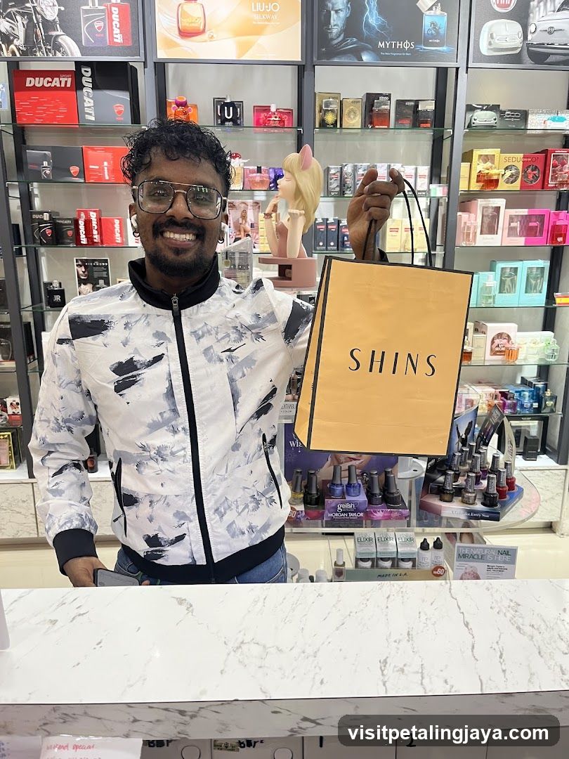 Man holding a shopping bag in a store
