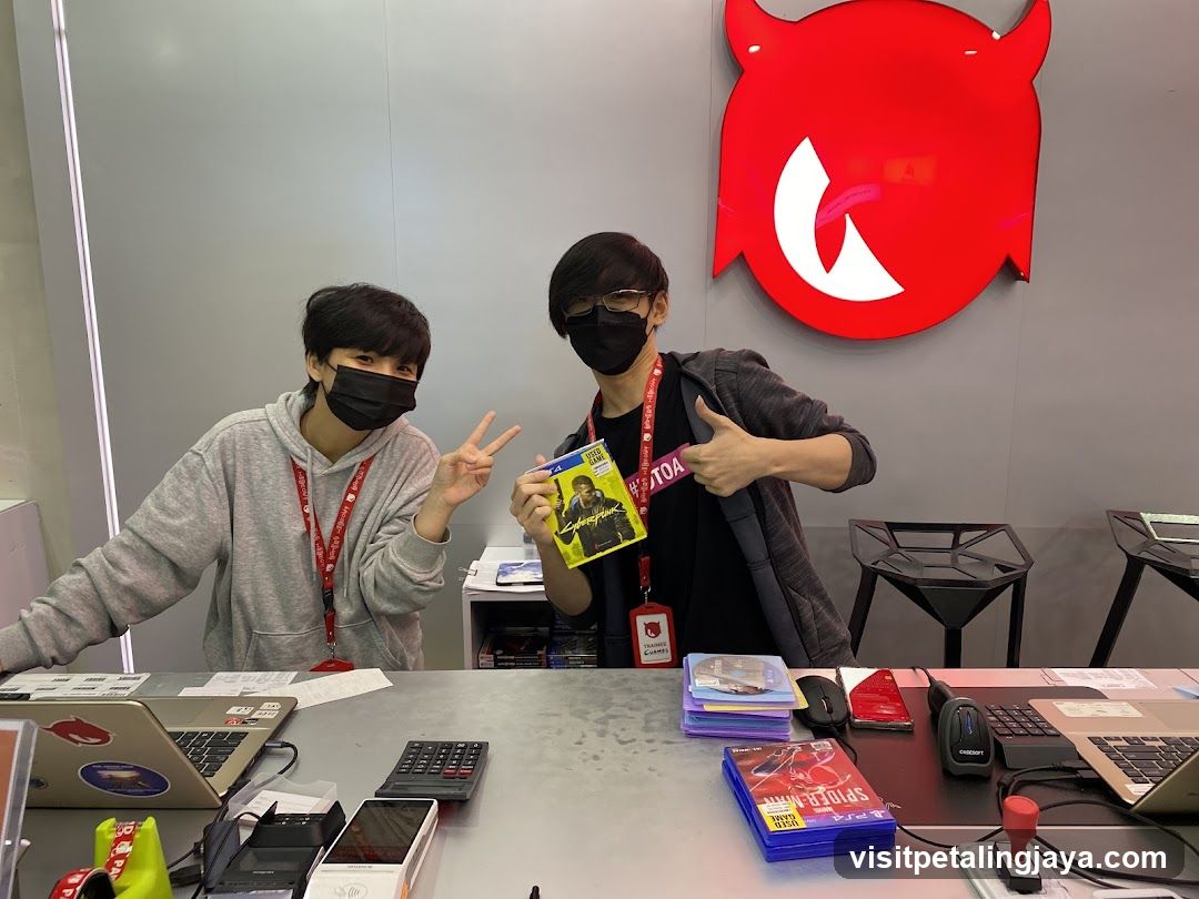 Two people behind a counter