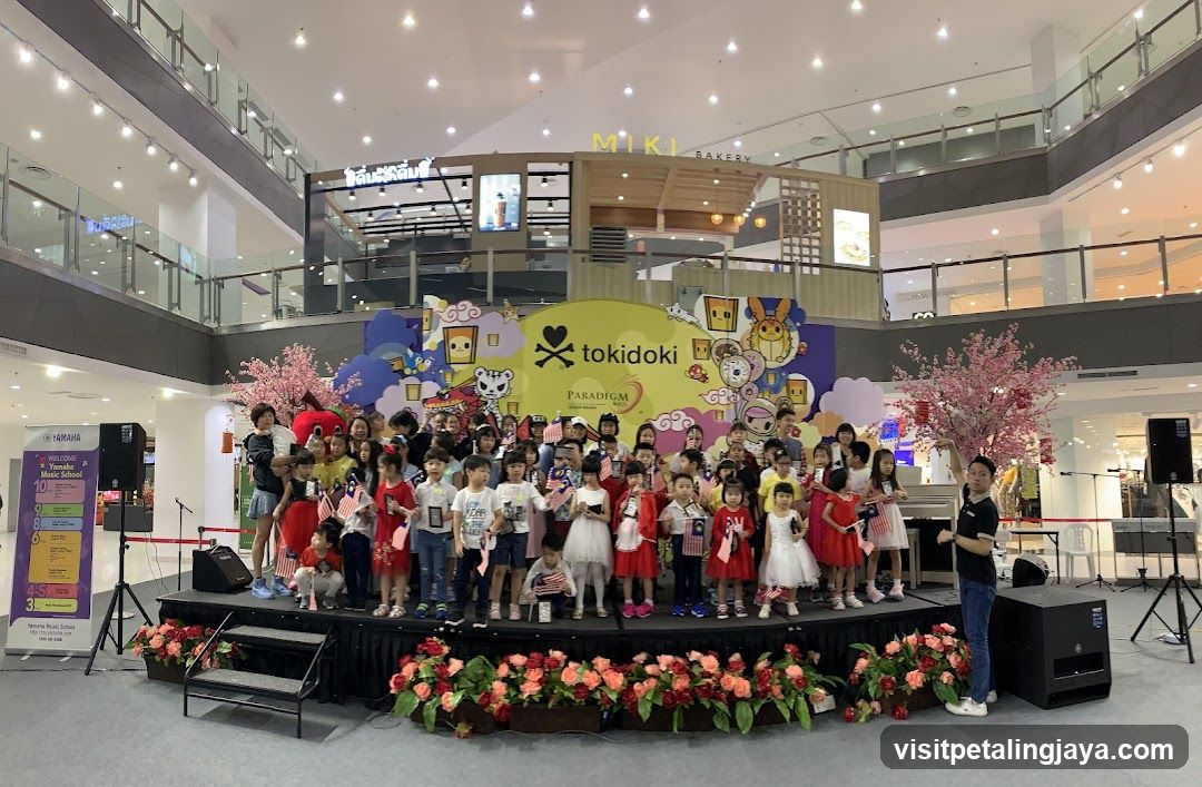 Children on stage with Tokidoki backdrop