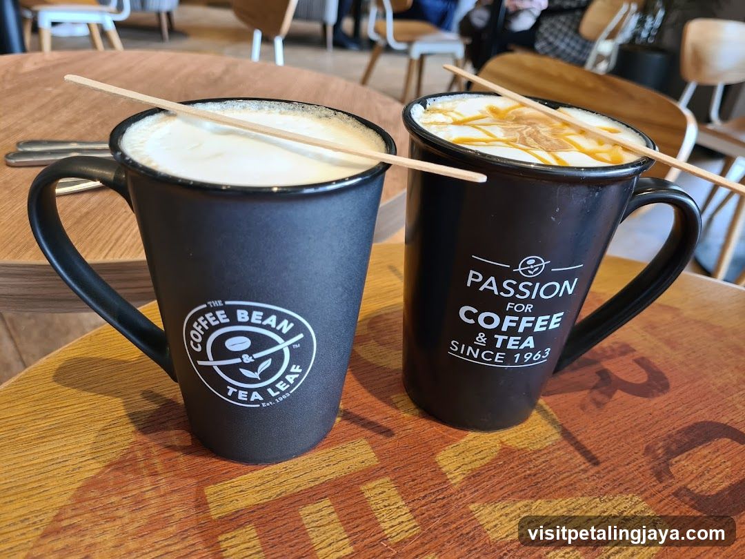 Two coffee mugs with stir sticks