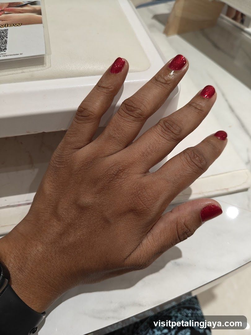 Hand with Red Nail Polish