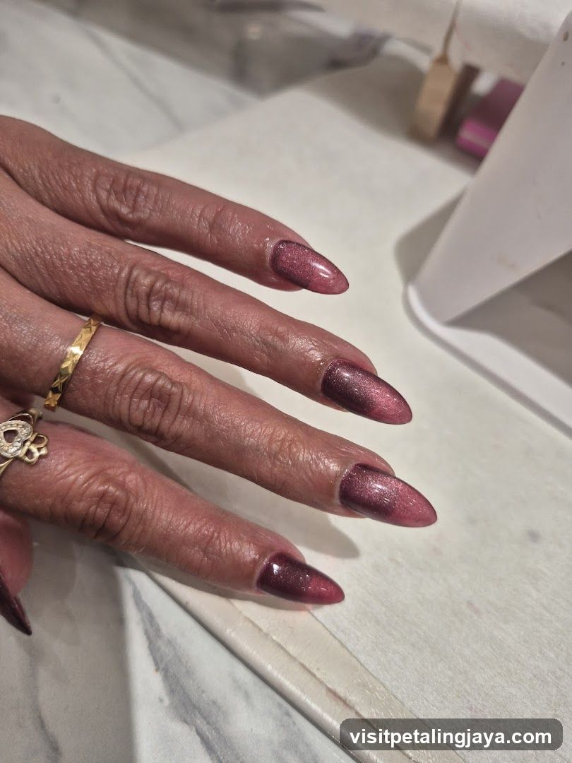 Woman's Hands with Cat Eye Nails