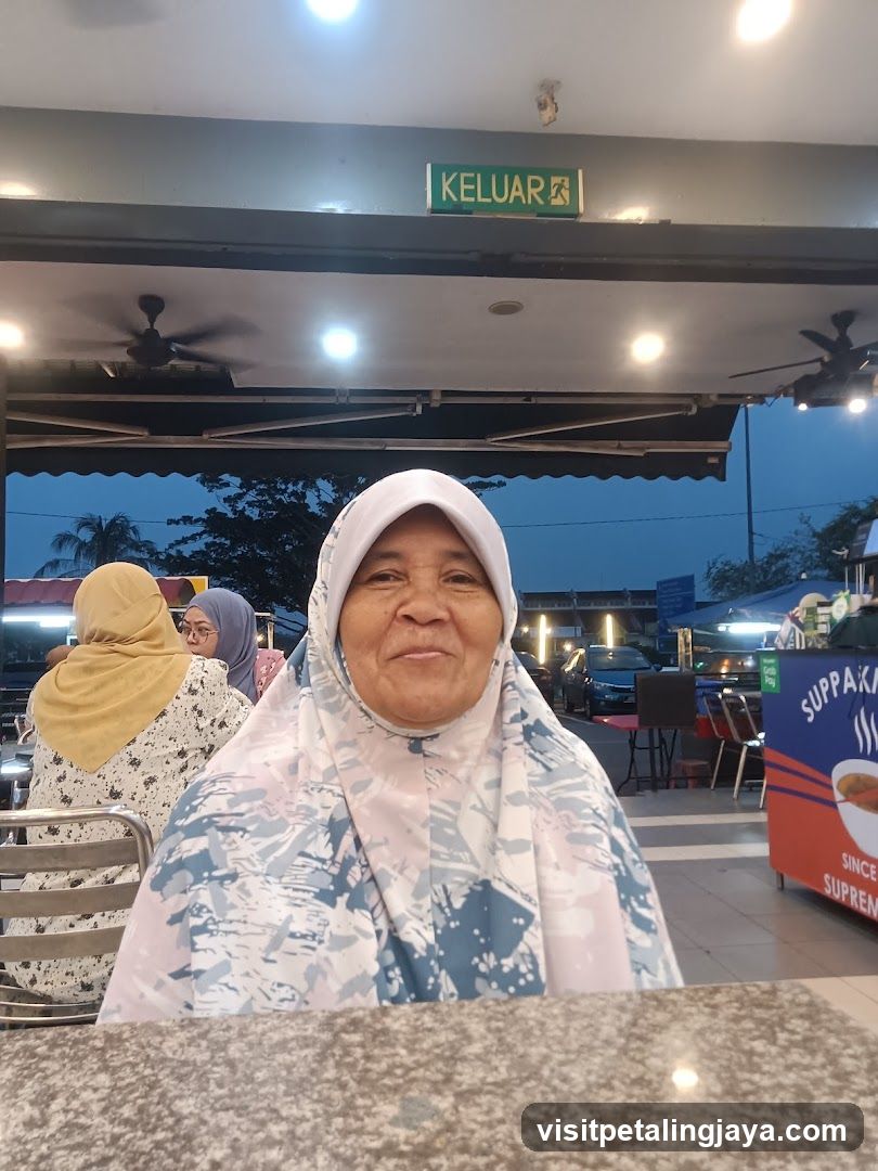 Woman in a hijab at a table