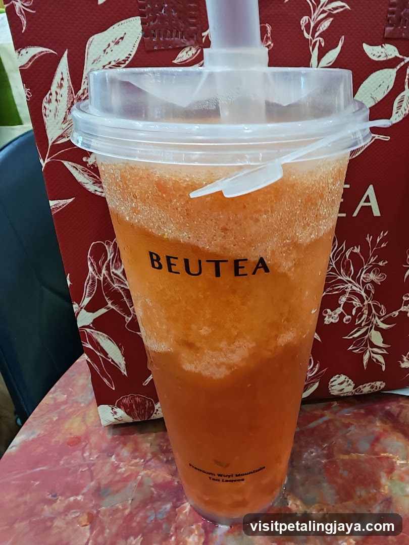 Orange Drink with BEUTEA Logo