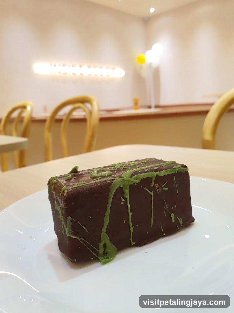 Chocolate dessert with green drizzle