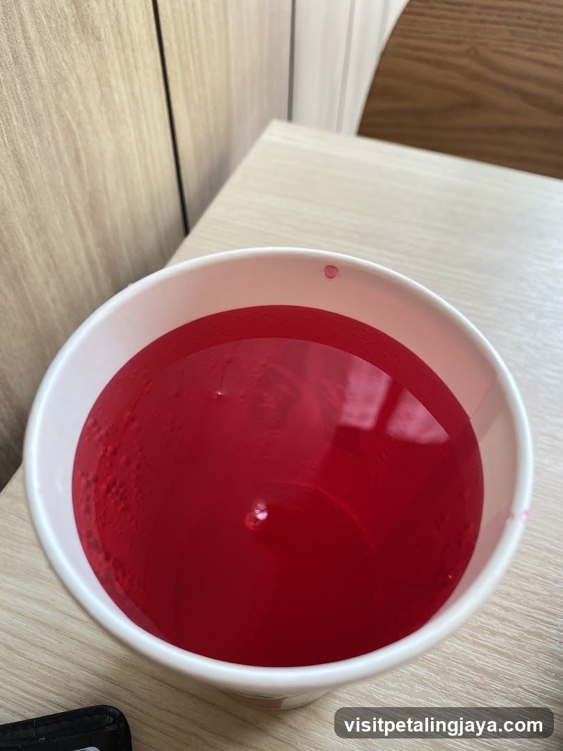 Red Drink in a White Cup