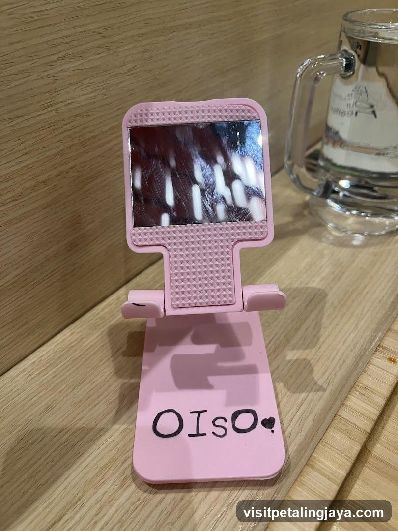 Pink phone stand with text