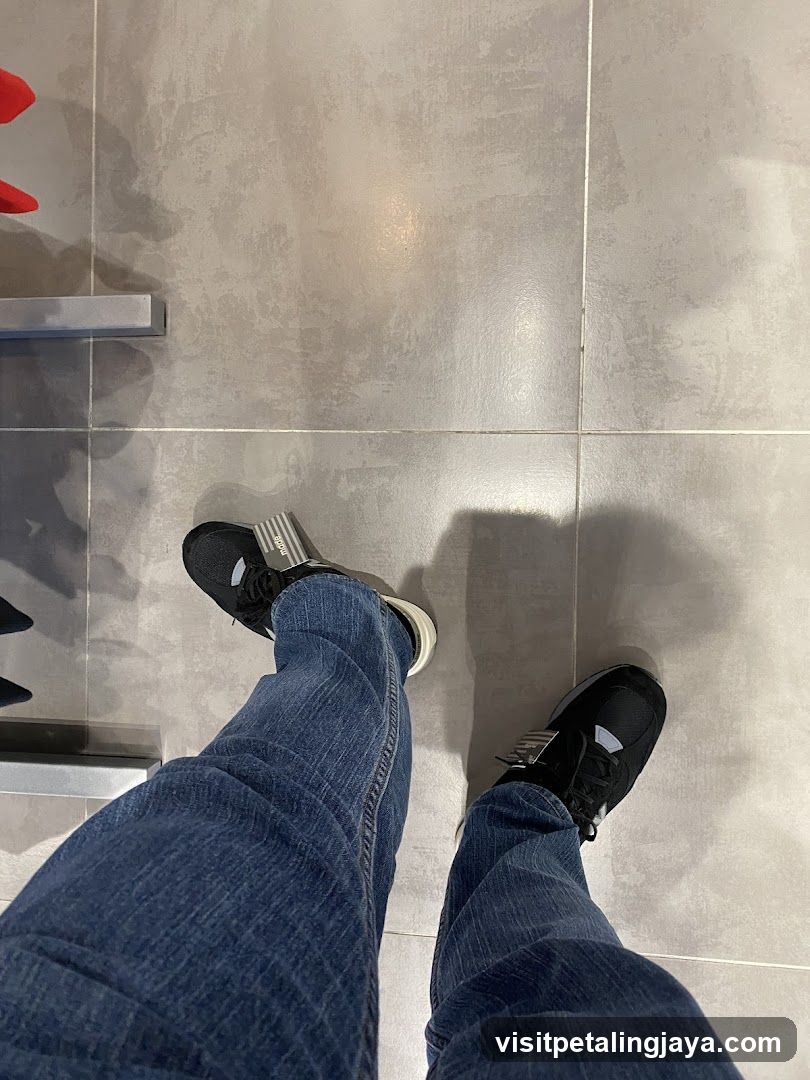 Person wearing jeans and sneakers