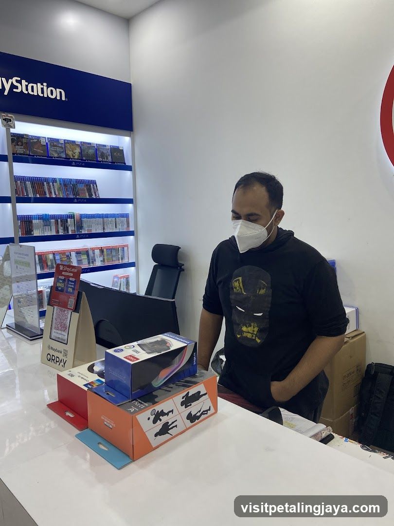 Man in a store with PlayStation merchandise