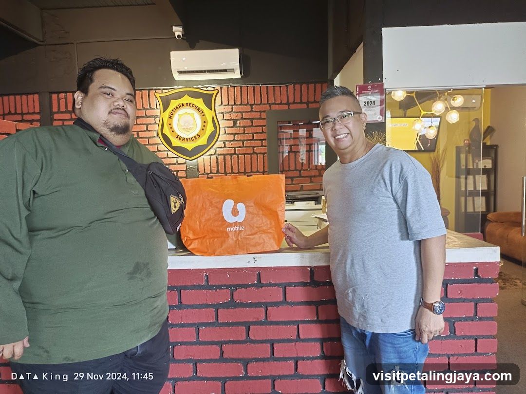 Two men with a shopping bag