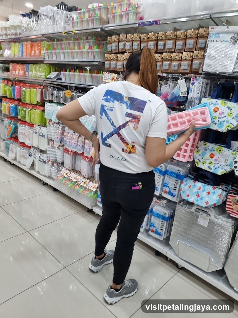 Woman holding ice cube trays in a store
