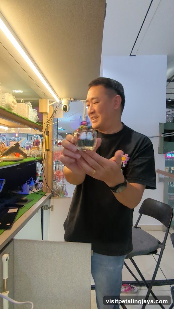 Man holding a decorative glass item