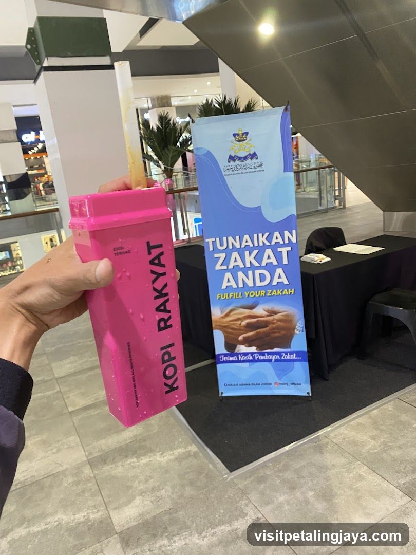 Kopi Rakyat Tumbler and Zakat Banner