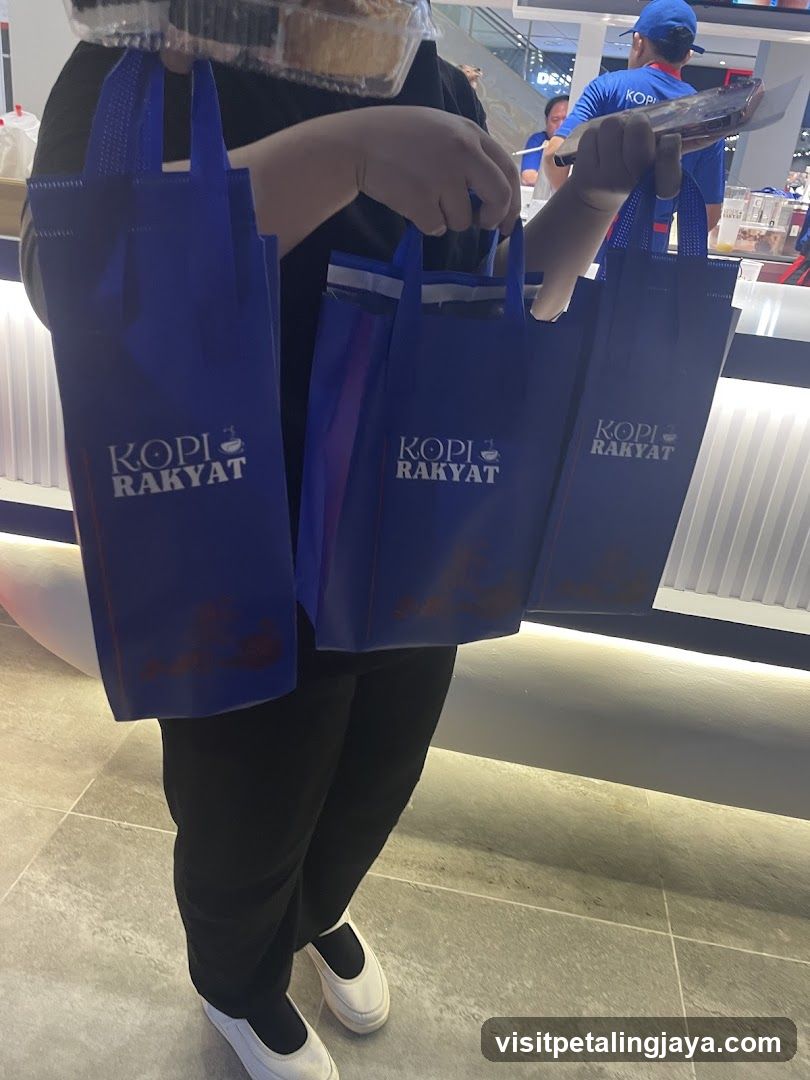 Person holding shopping bags