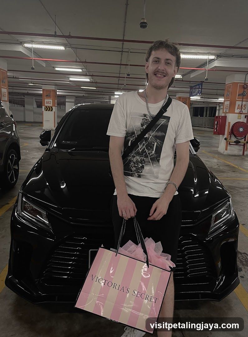 Man with Victoria's Secret Bag in Parking Garage