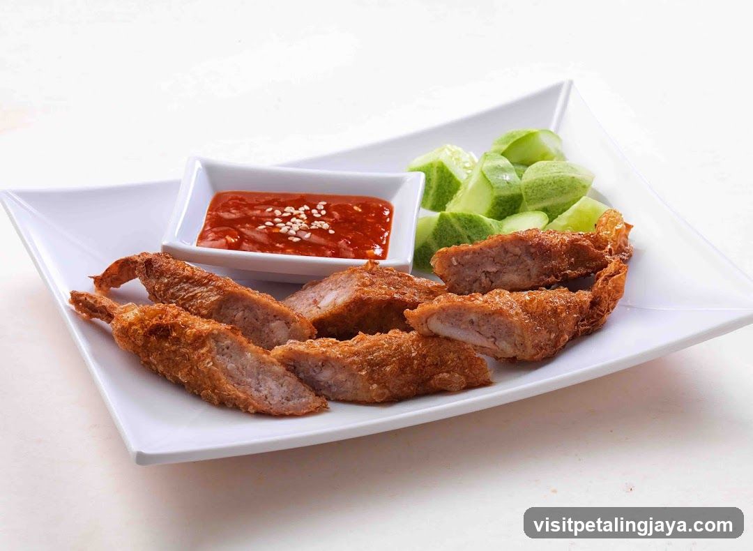 Fried Shrimp Rolls with Dipping Sauce and Cucumber Slices