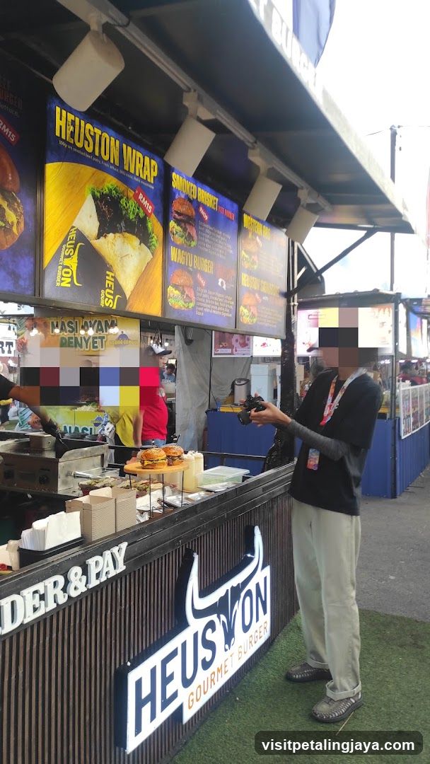 Food stall with menu and burgers