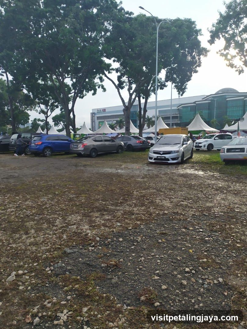 Parking Lot with Tents and Building
