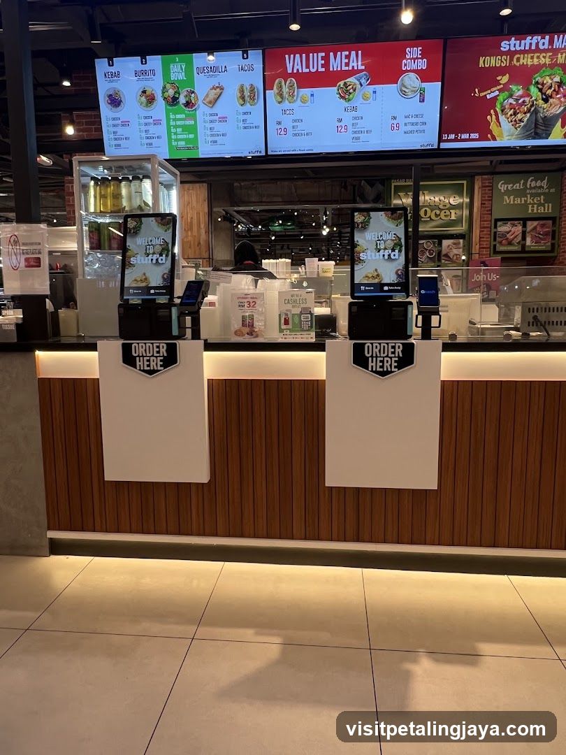 Food stall counter with digital menus and order stations