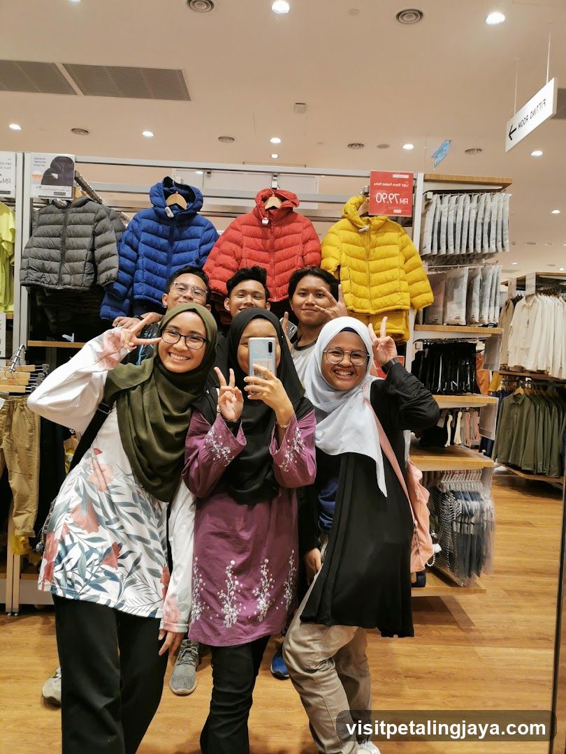 Group of friends posing in a clothing store