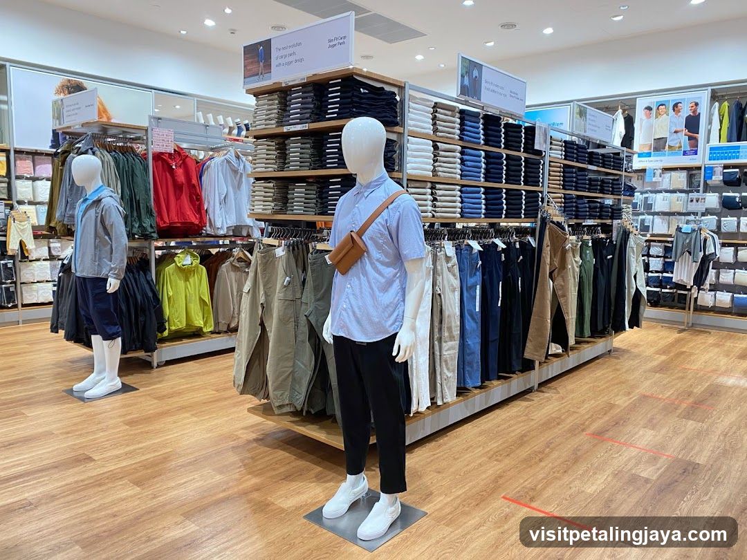 Clothing store interior with mannequins and folded clothes