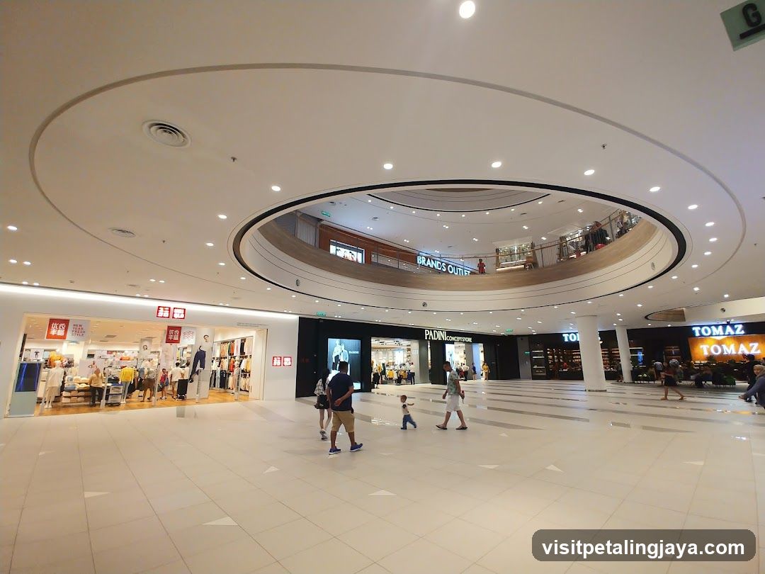 Interior of a shopping mall with various stores