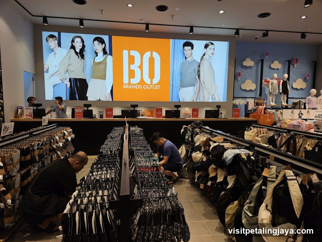 Clothing store interior with large digital display