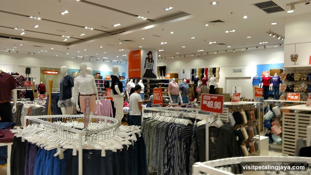 Clothing store interior with mannequins and sale signs