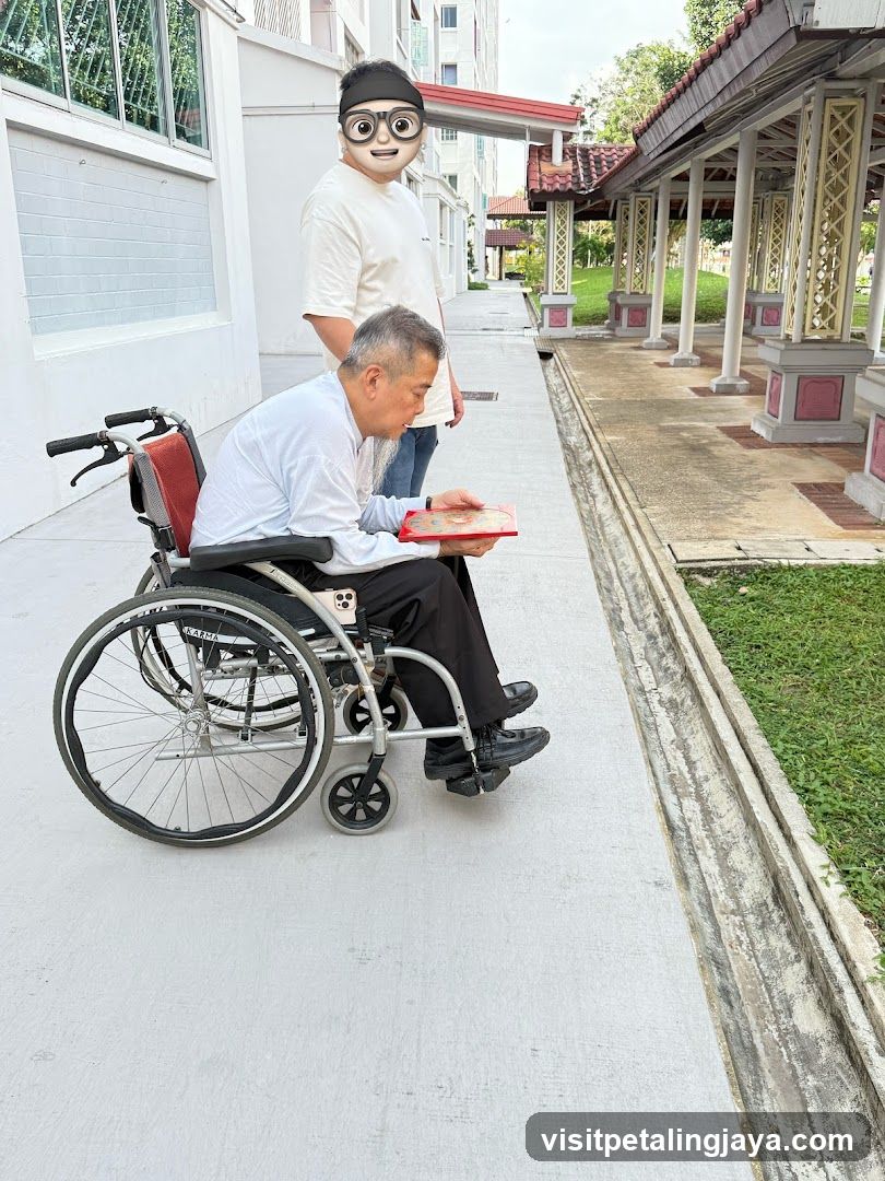 Man in Wheelchair Looking at a Book