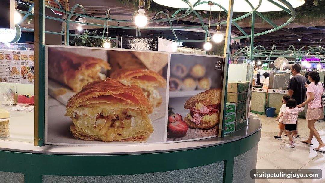 Food stall with large pastry images
