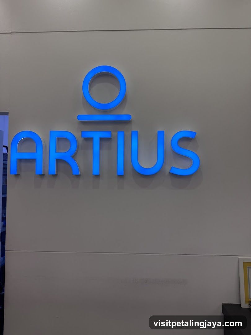 Blue illuminated logo on a wall