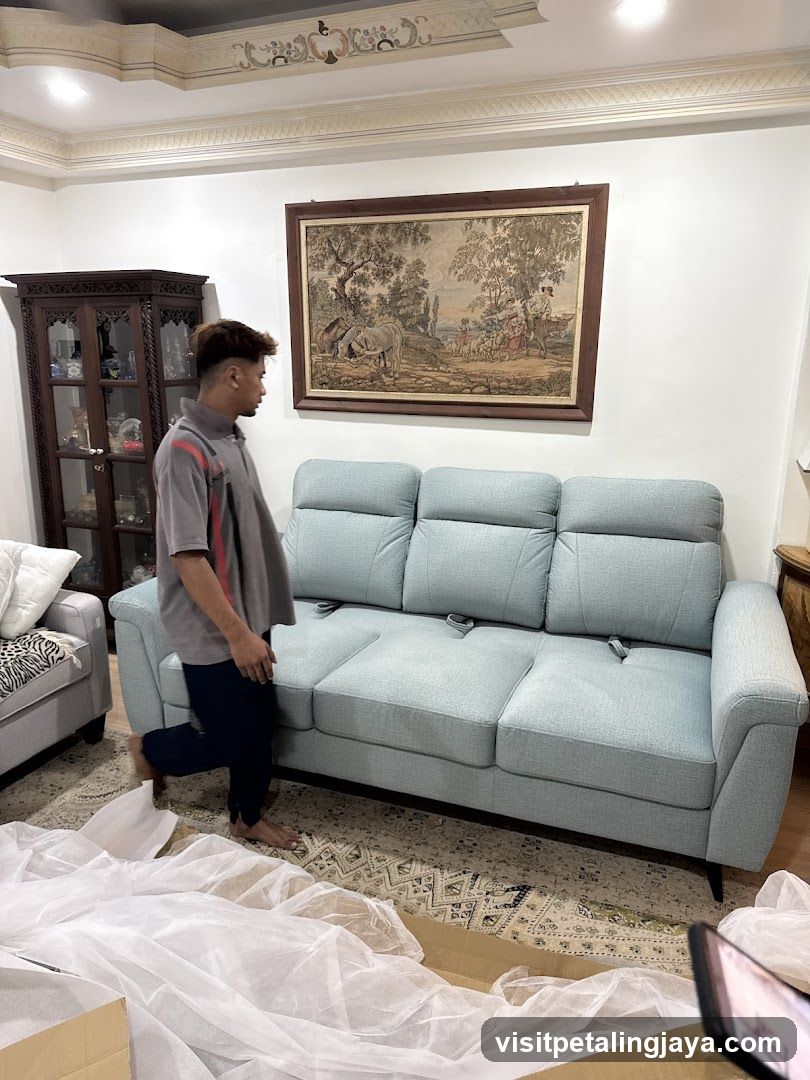 Man Unpacking a Sofa