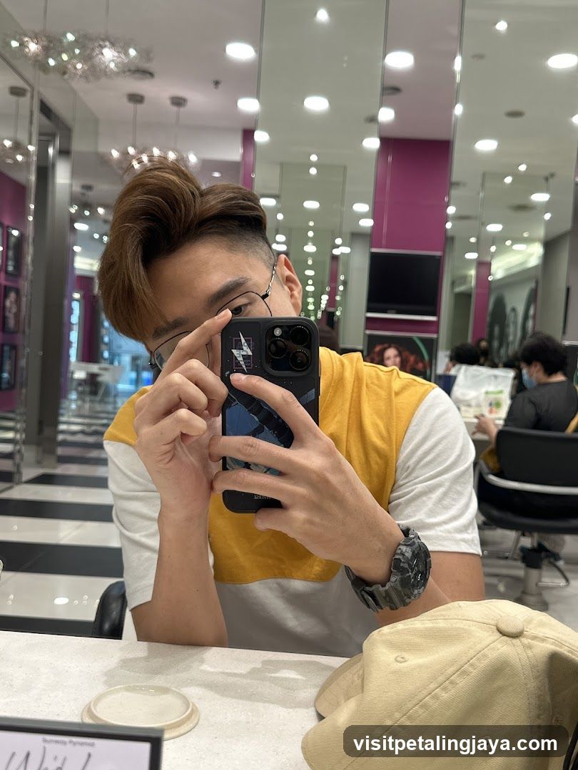 Man taking a selfie in a salon