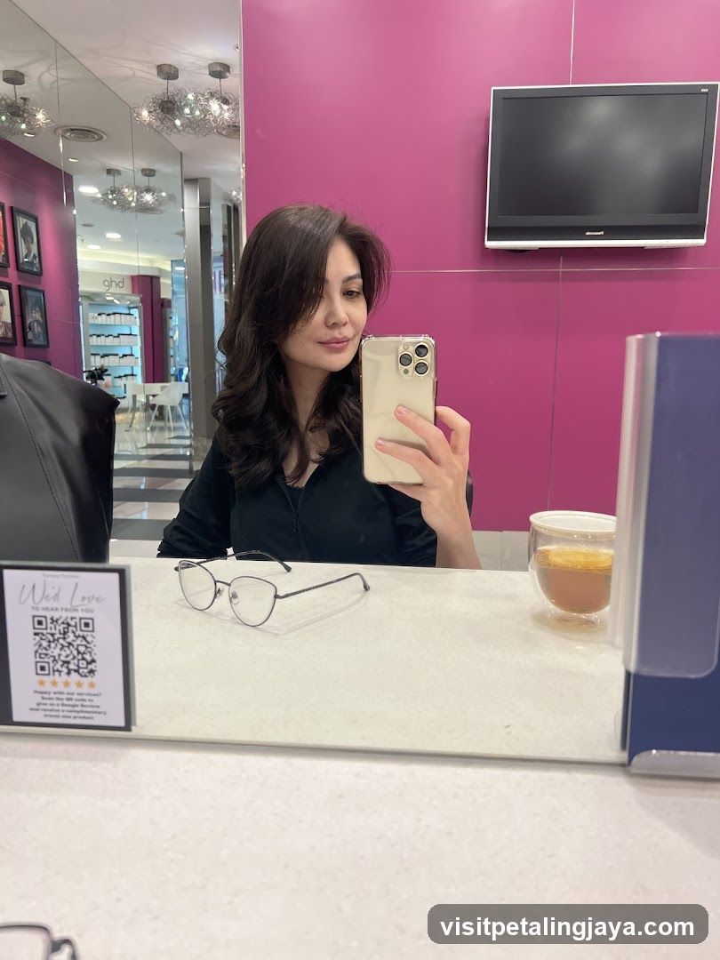 Woman taking a selfie in a salon